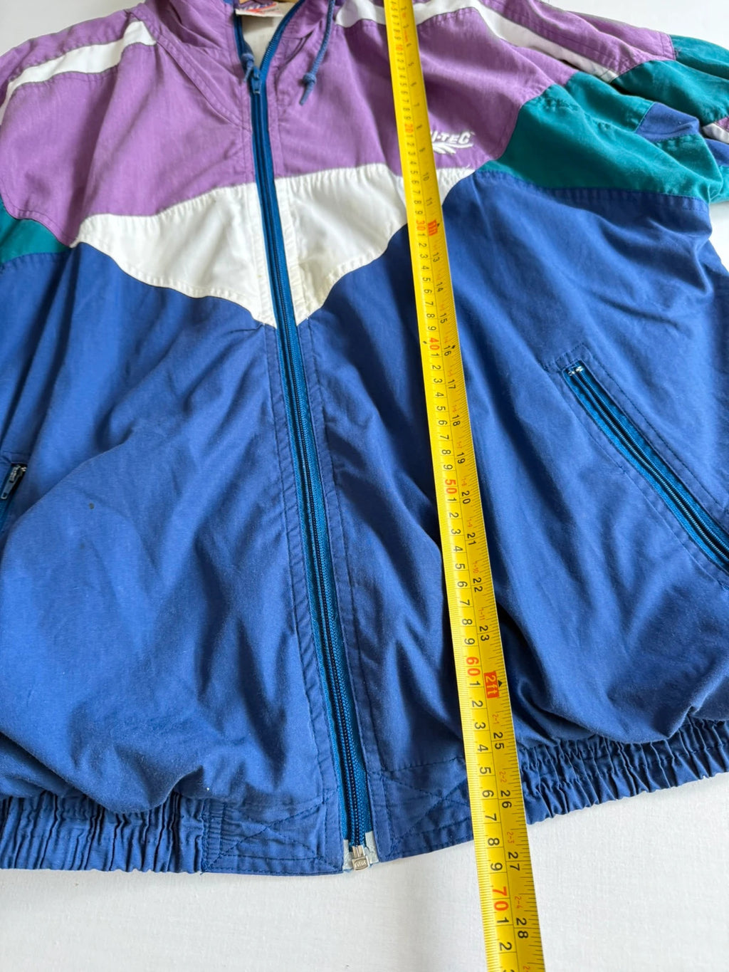 HI-TEC 90s colourblock shell jacket purple with teal and navy chevron panels.