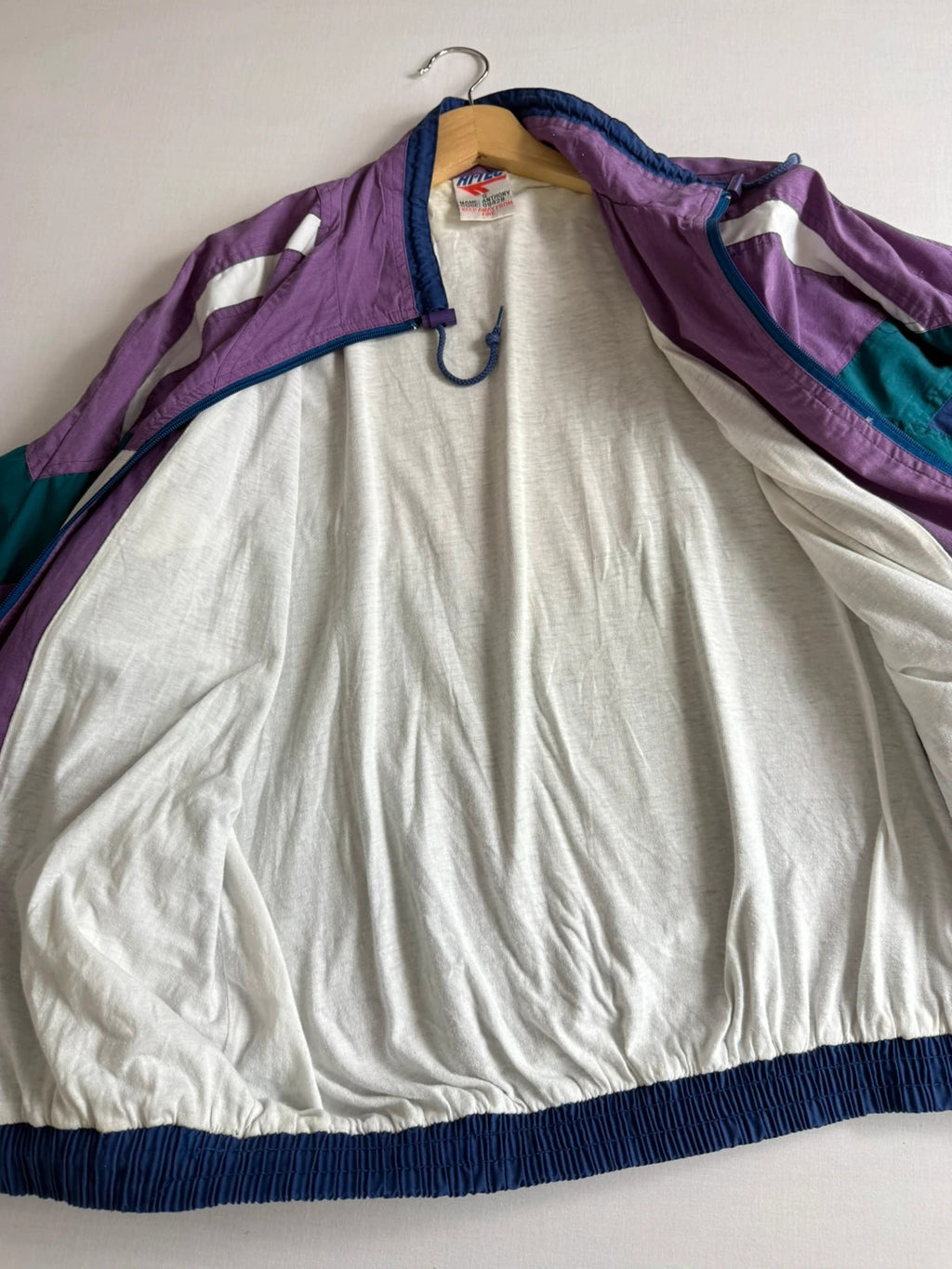 HI-TEC 90s colourblock shell jacket purple with teal and navy chevron panels.