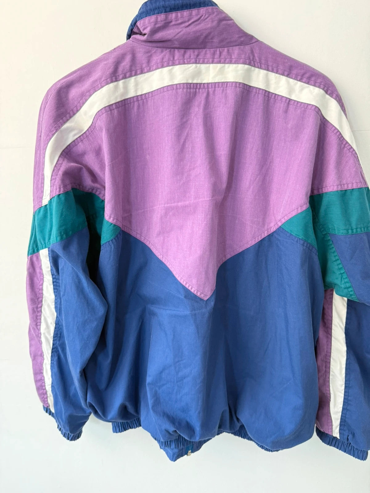 HI-TEC 90s colourblock shell jacket purple with teal and navy chevron panels.
