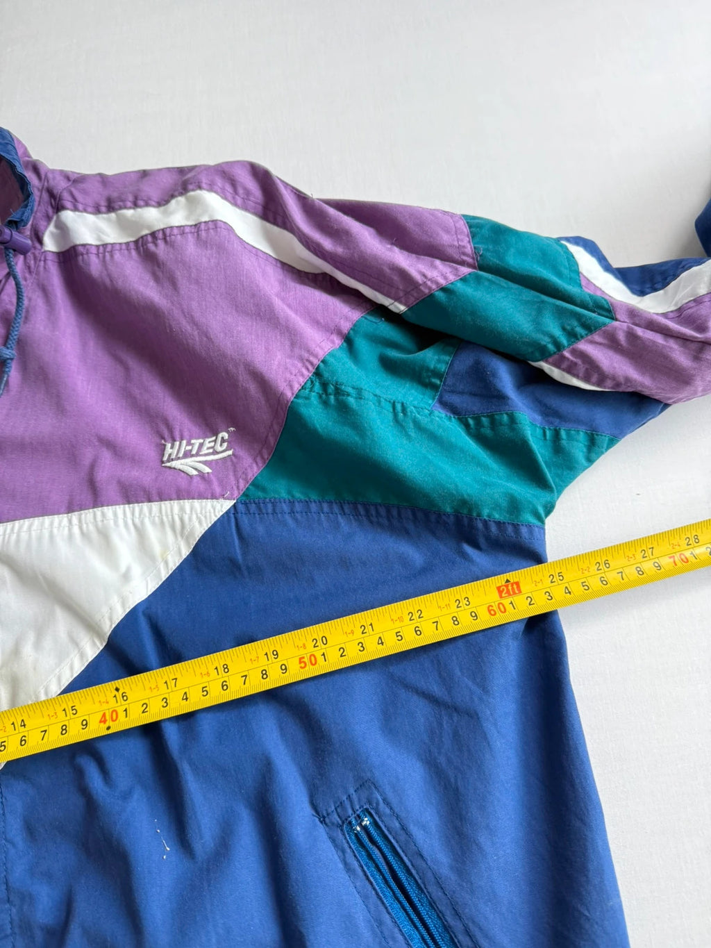 HI-TEC 90s colourblock shell jacket purple with teal and navy chevron panels.