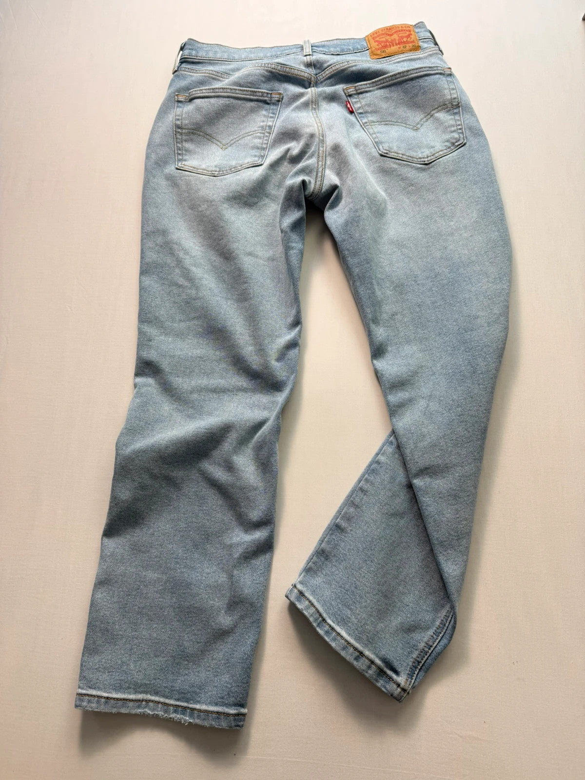 Levi's blue straight jeans light wash stretch denim with signature back-pocket arcuate stitching.