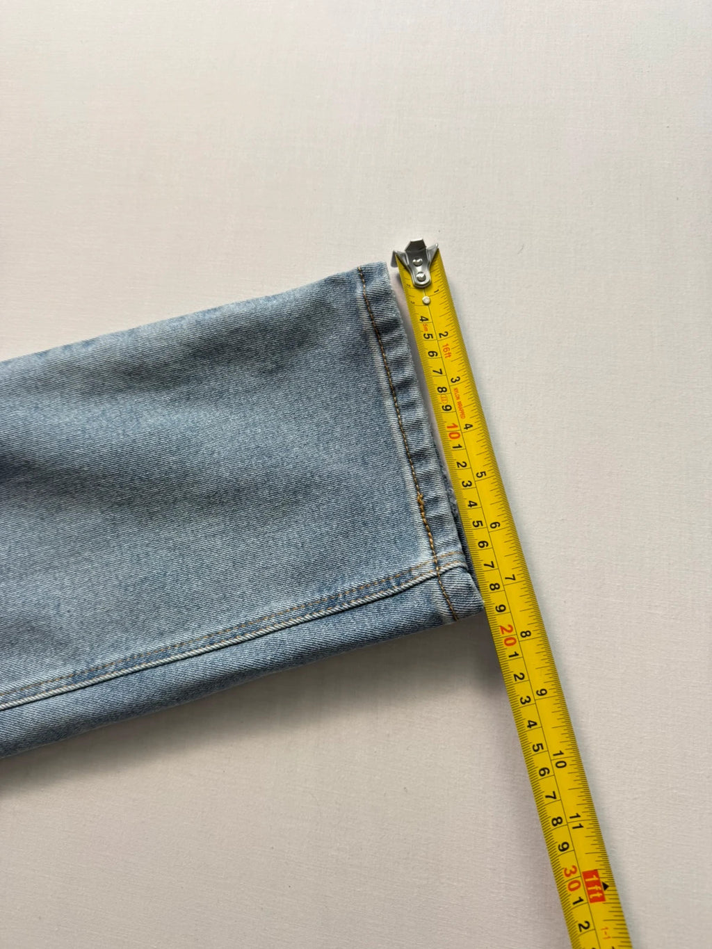 Levi's blue straight jeans light wash stretch denim with signature back-pocket arcuate stitching.