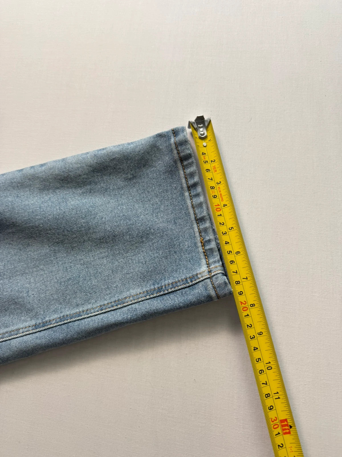 Levi's blue straight jeans light wash stretch denim with signature back-pocket arcuate stitching.