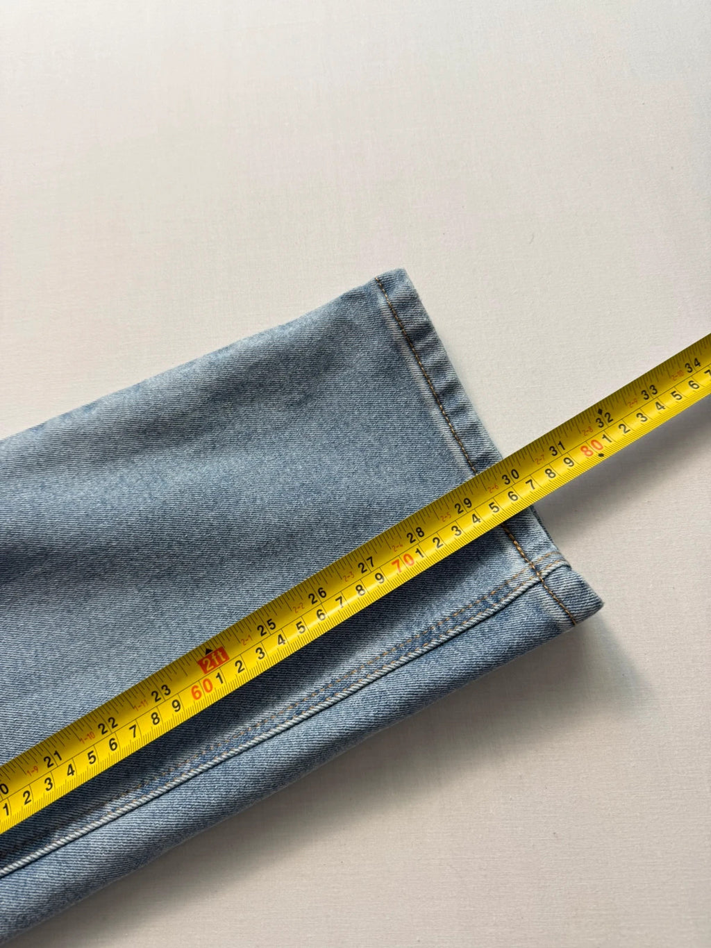 Levi's blue straight jeans light wash stretch denim with signature back-pocket arcuate stitching.