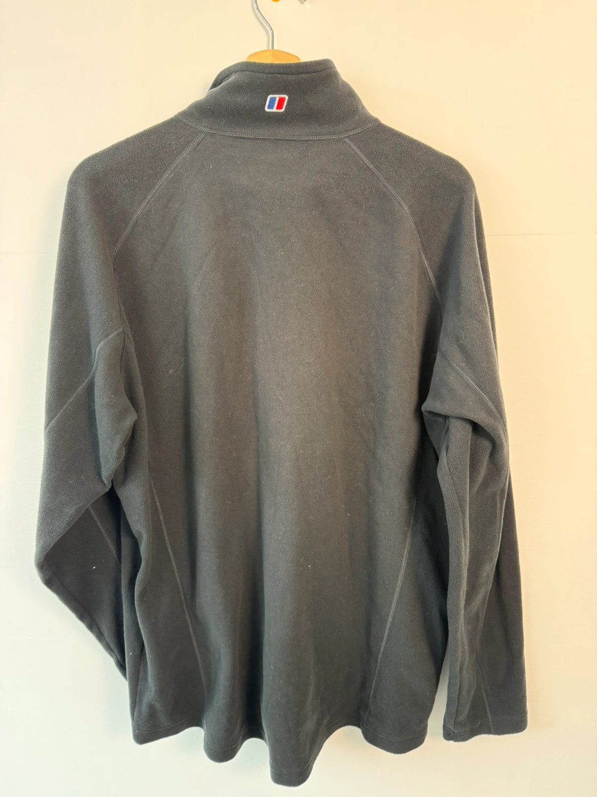 Berghaus grey fleece jacket with stand-up collar and zipped pockets, lightweight polyester.