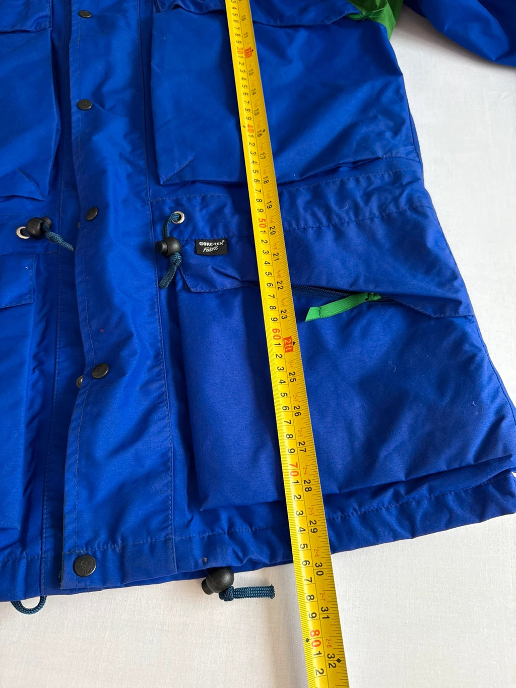 Berghaus blue green 90s Mera Peak jacket with colour-block design and Gore-Tex fabric.