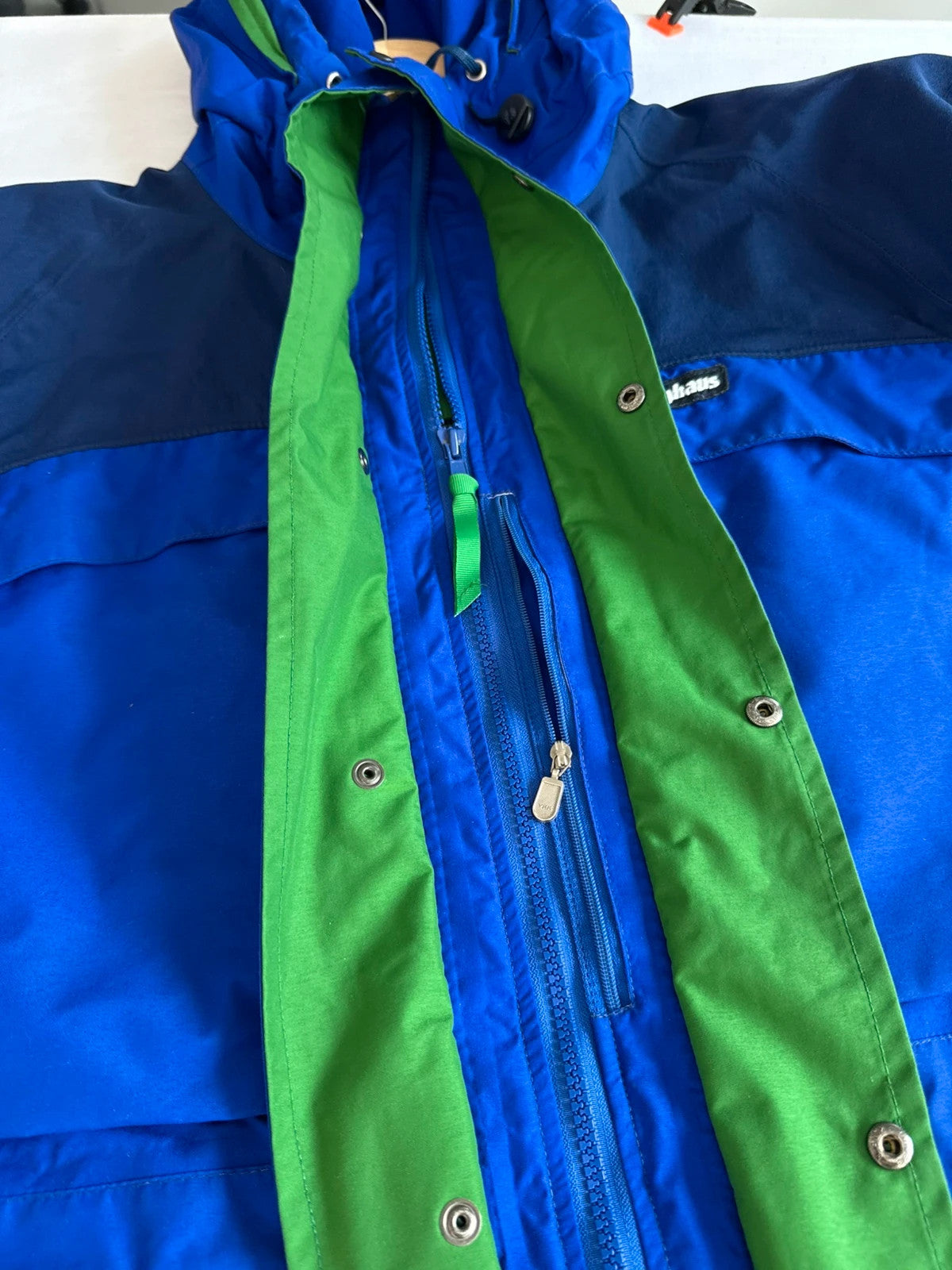 Berghaus blue green 90s Mera Peak jacket with colour-block design and Gore-Tex fabric.