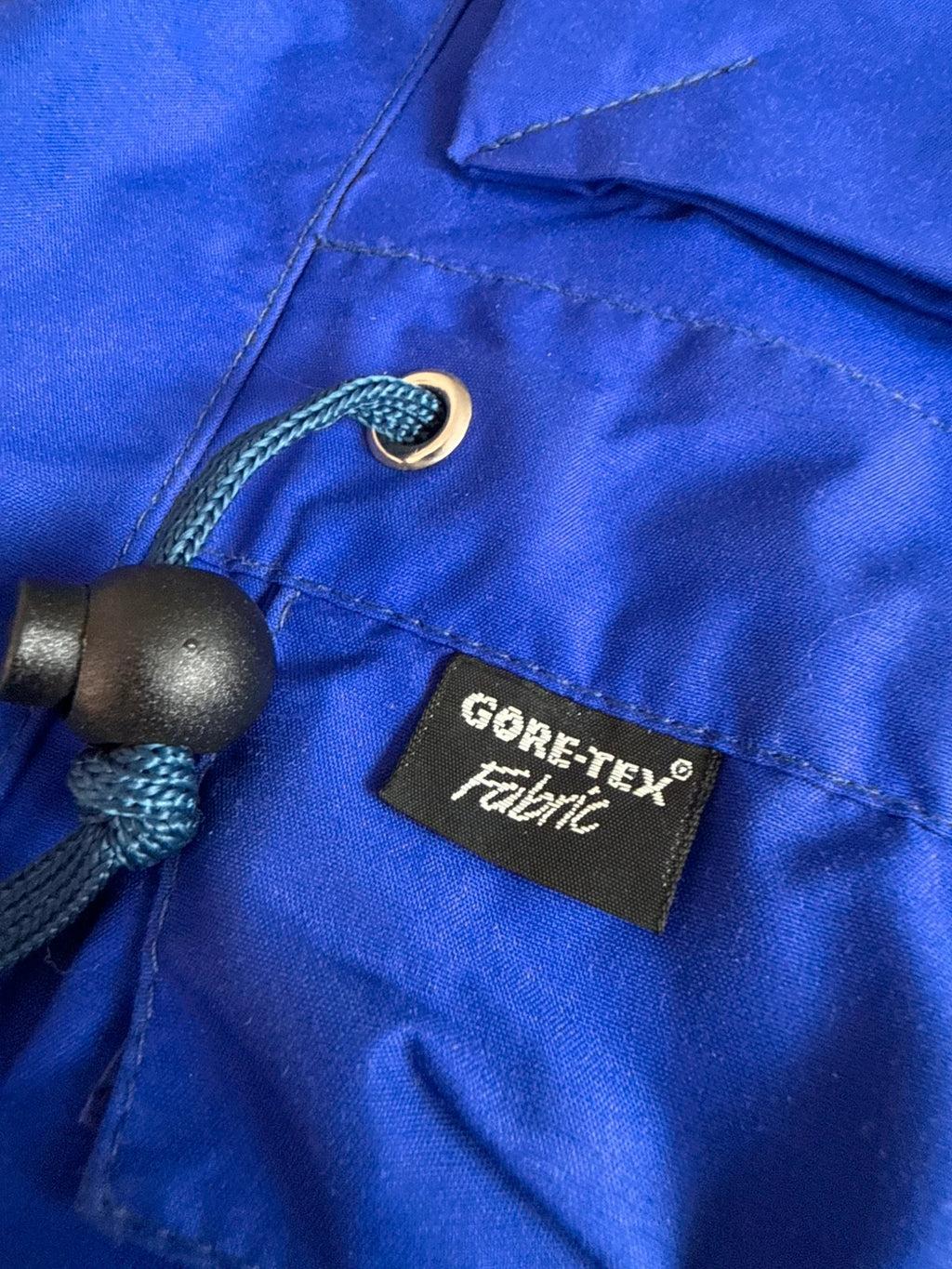 Berghaus blue green 90s Mera Peak jacket with colour-block design and Gore-Tex fabric.