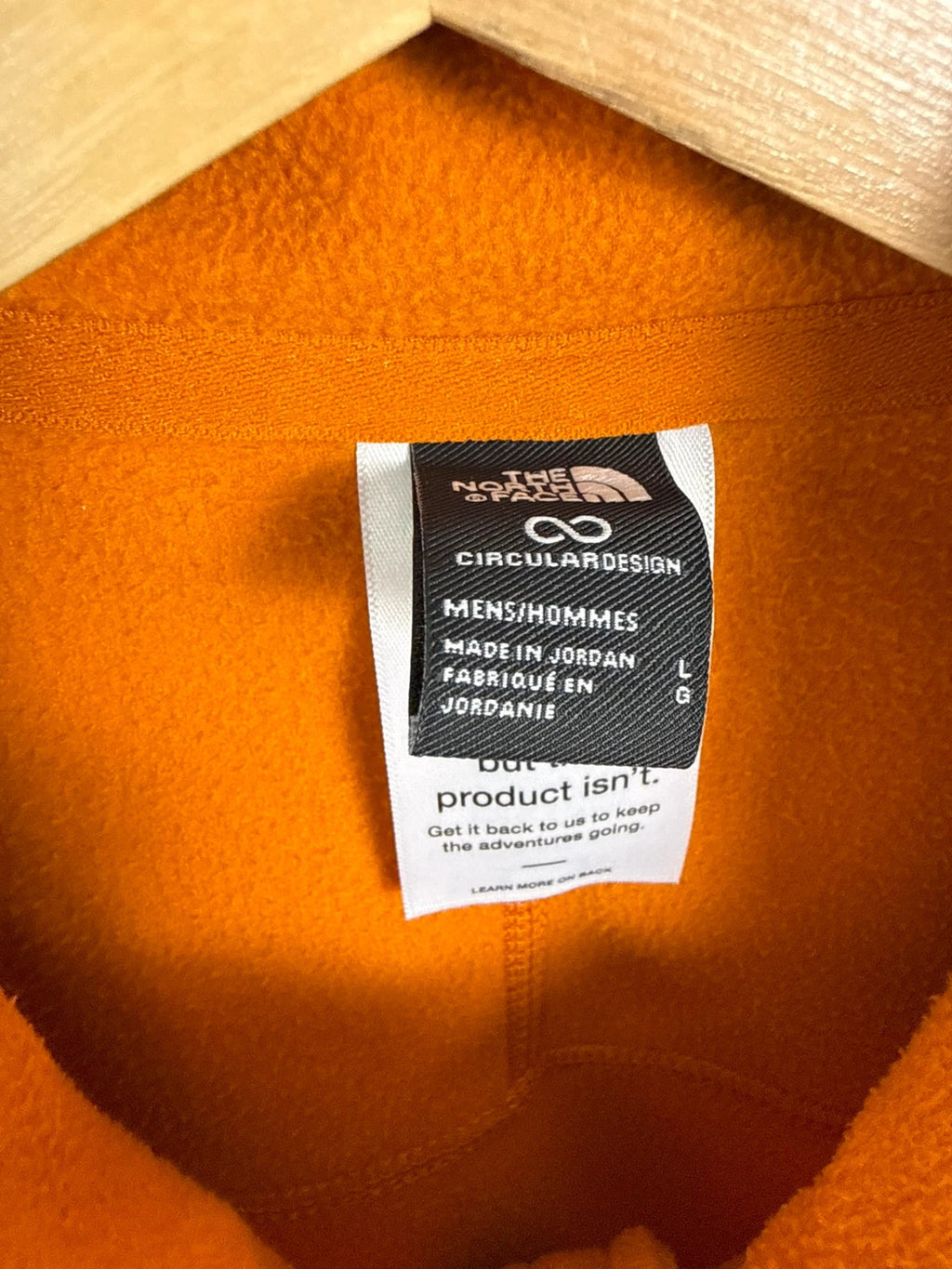 The North Face orange fleece jacket with embroidered logo and high stand collar.