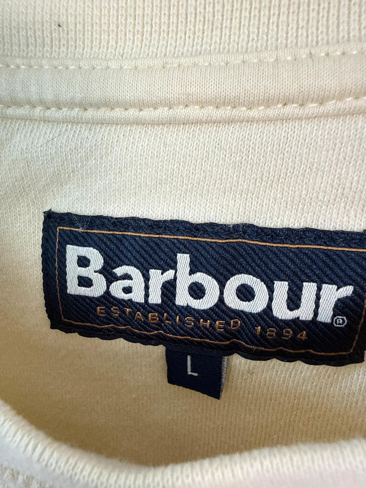 Barbour cream sweatshirt with grey colourblock panel and embroidered crest logo.