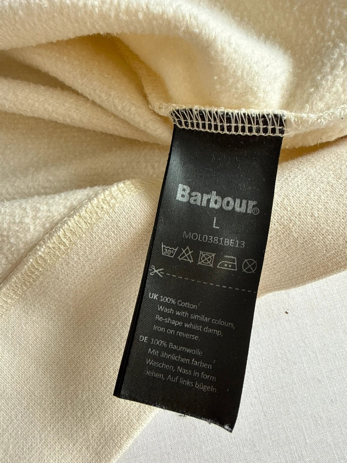 Barbour cream sweatshirt with grey colourblock panel and embroidered crest logo.