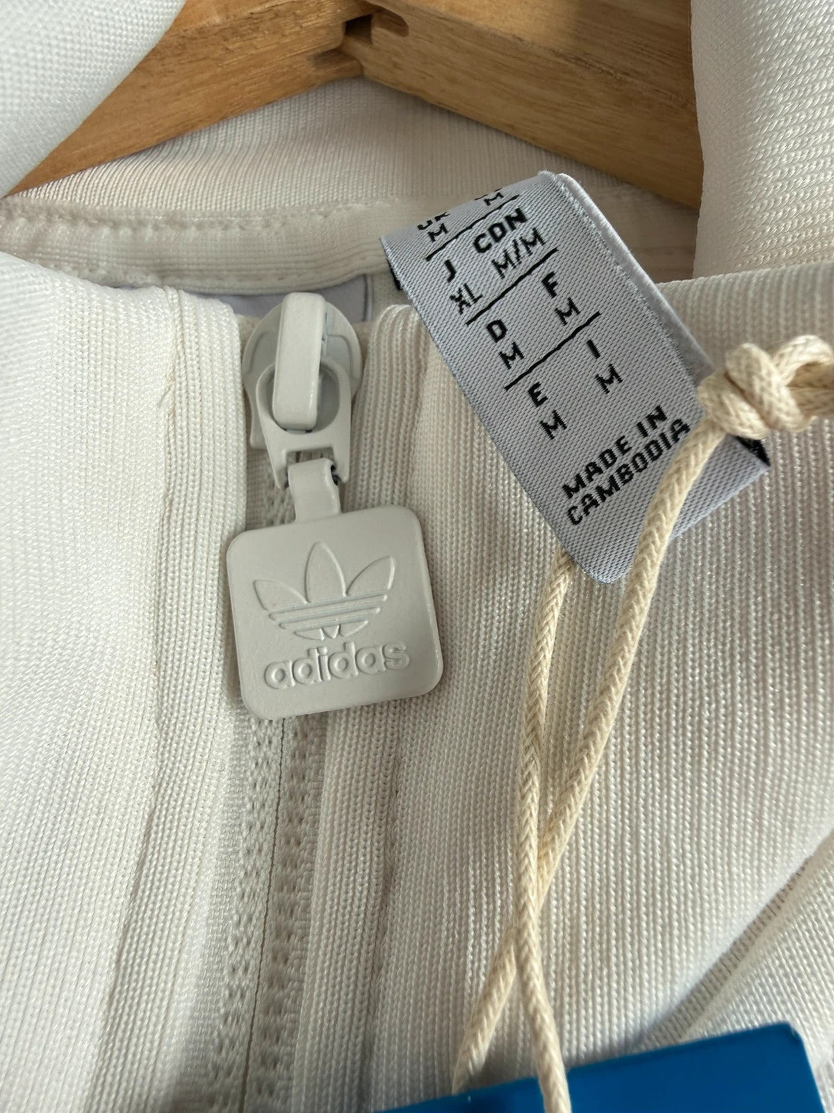 Adidas white track top with red 3-stripes, tonal stripes, full zip, stand-up collar.
