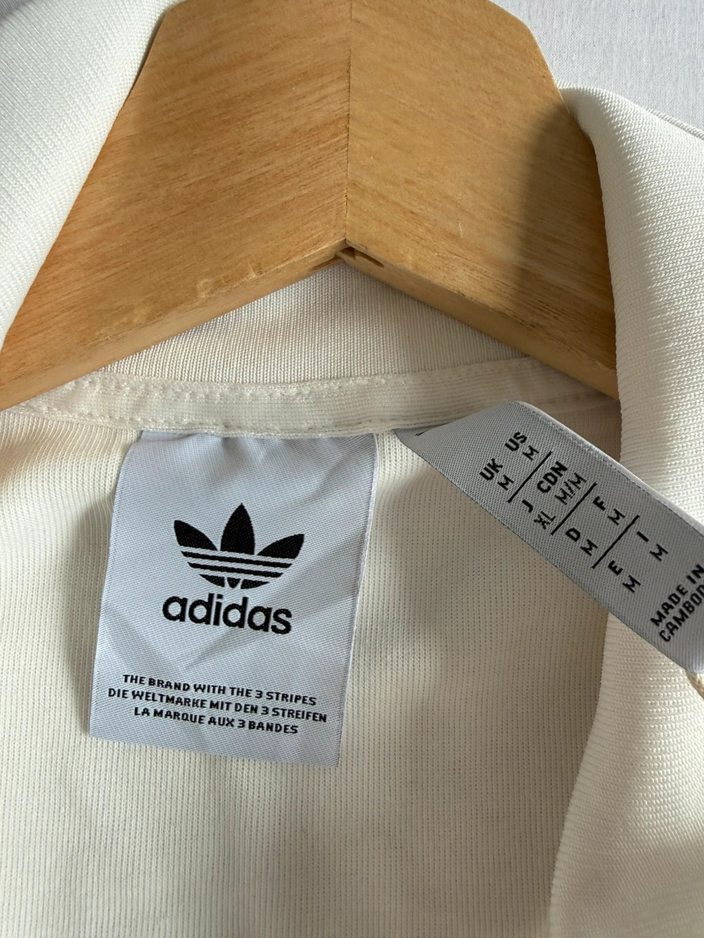 Adidas white track top with red 3-stripes, tonal stripes, full zip, stand-up collar.