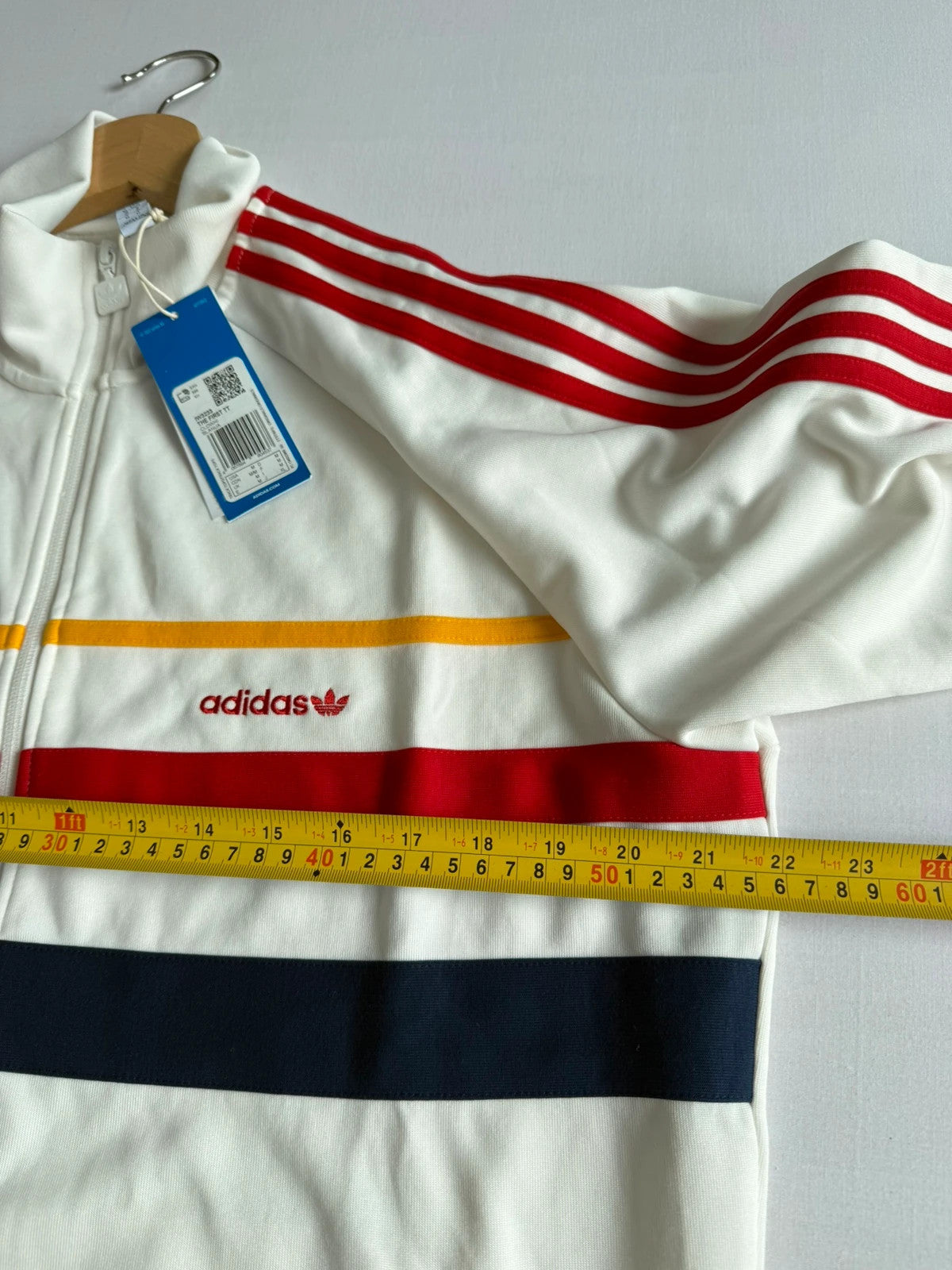 Adidas white track top with red 3-stripes, tonal stripes, full zip, stand-up collar.