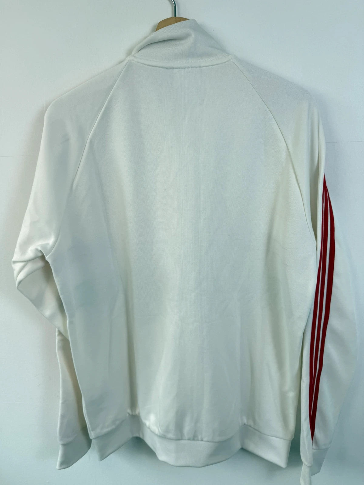 Adidas white track top with red 3-stripes, tonal stripes, full zip, stand-up collar.