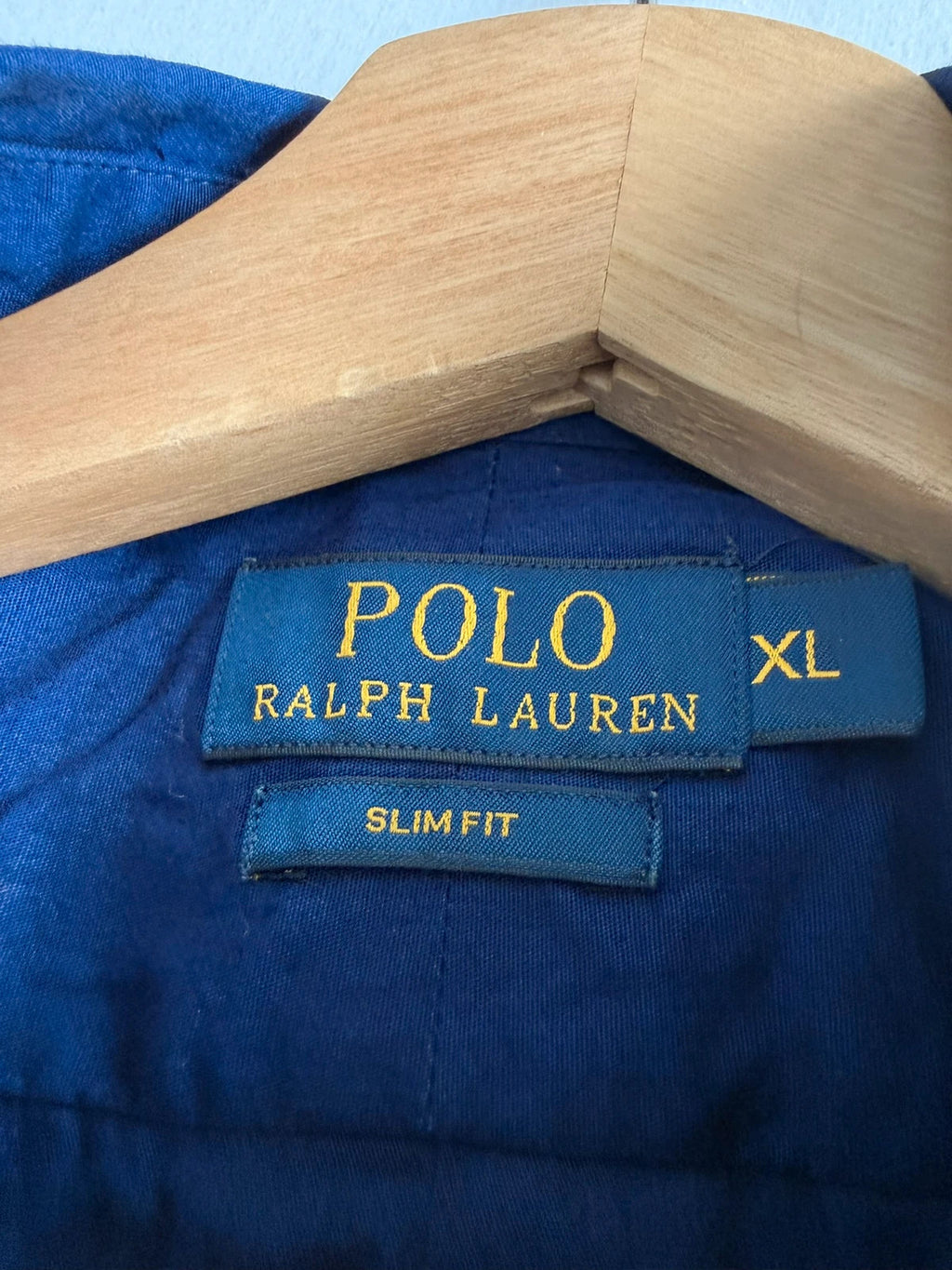 Ralph Lauren navy slim fit Oxford shirt with embroidered pony logo and button-down collar.