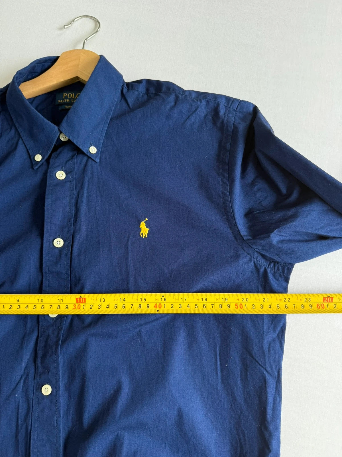 Ralph Lauren navy slim fit Oxford shirt with embroidered pony logo and button-down collar.