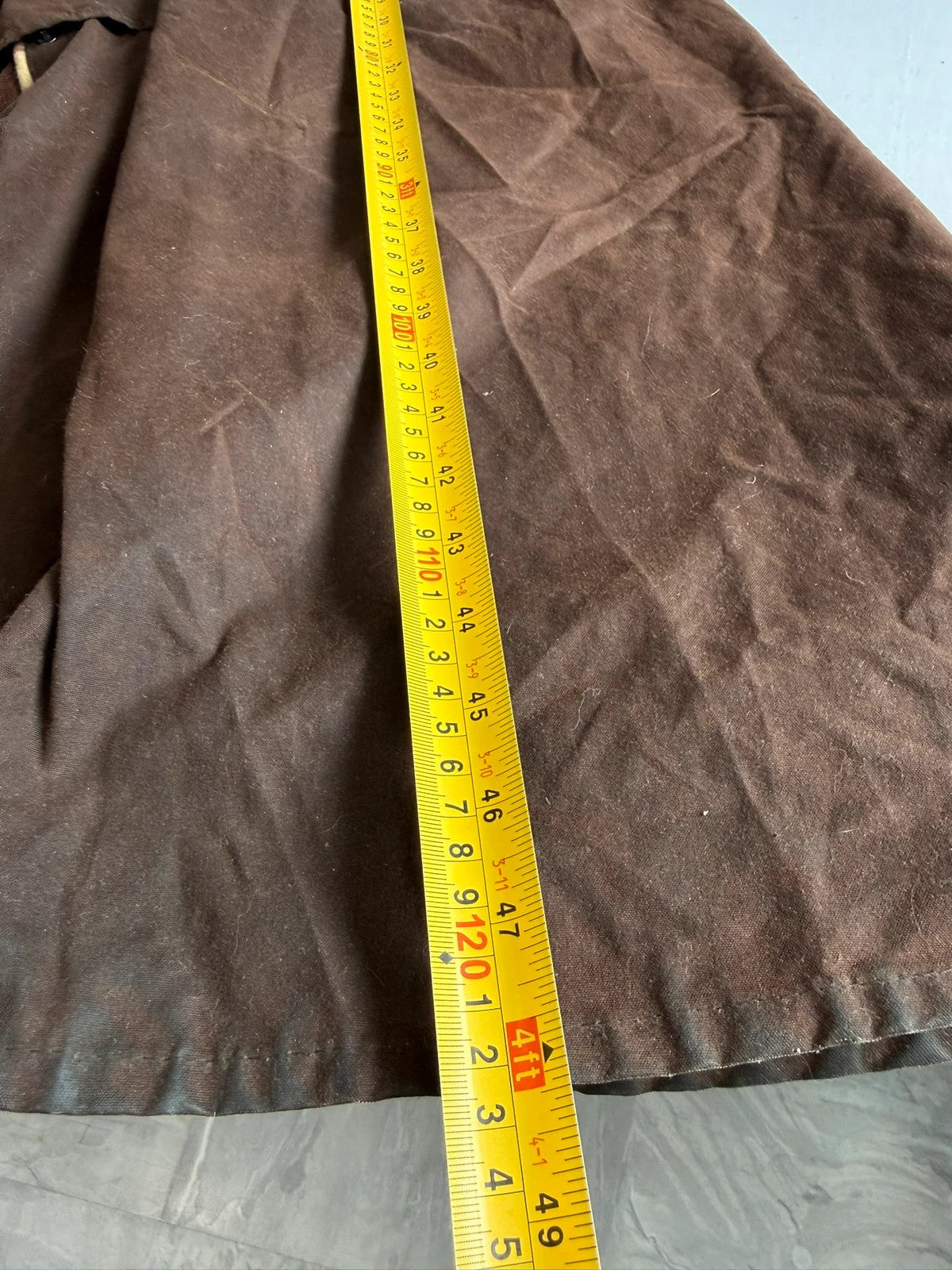 Barbour brown waxed cotton riding coat with corduroy collar and tartan lining.