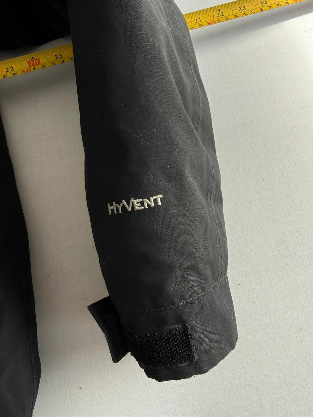 The North Face black parka with detachable faux fur hood and waterproof HyVent technology.