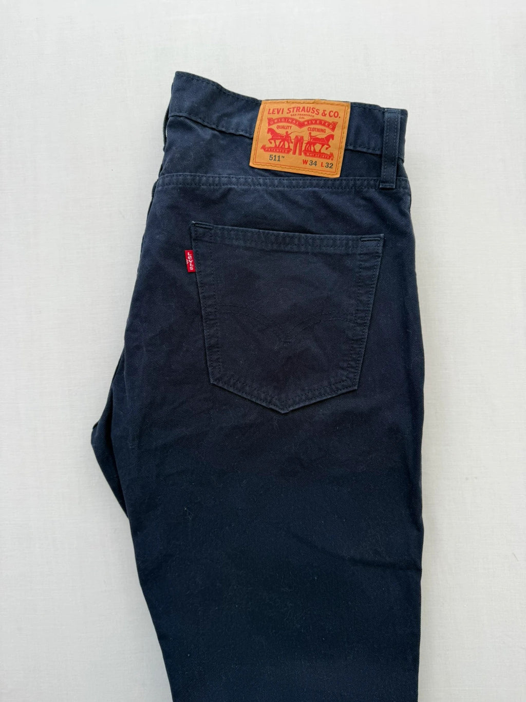 Levi's navy straight jeans with red tab logo and stretch cotton denim.