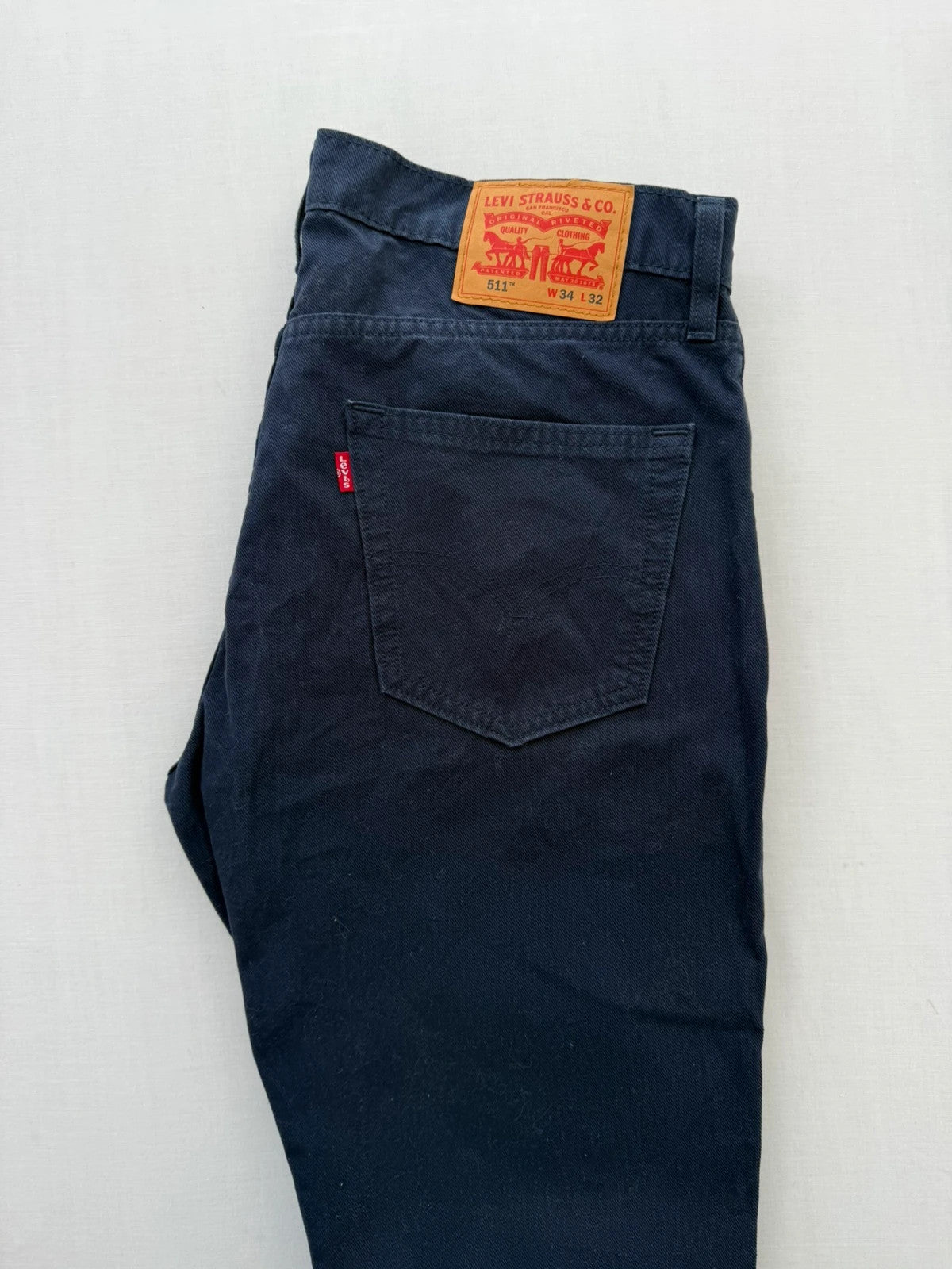 Levi's navy straight jeans with red tab logo and stretch cotton denim.