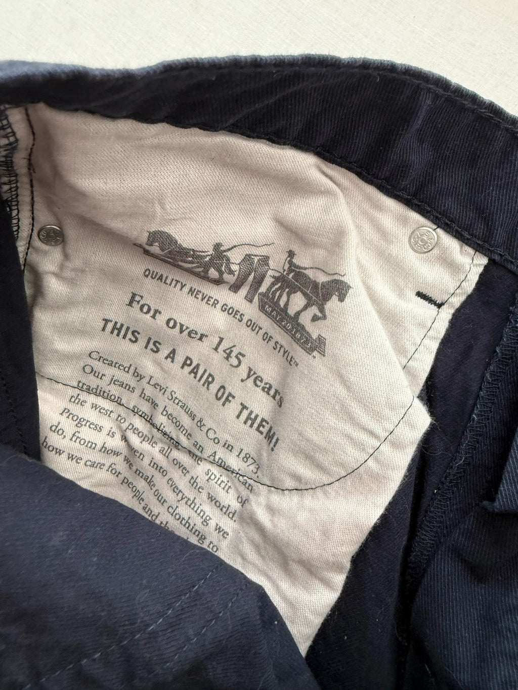 Levi's navy straight jeans with red tab logo and stretch cotton denim.