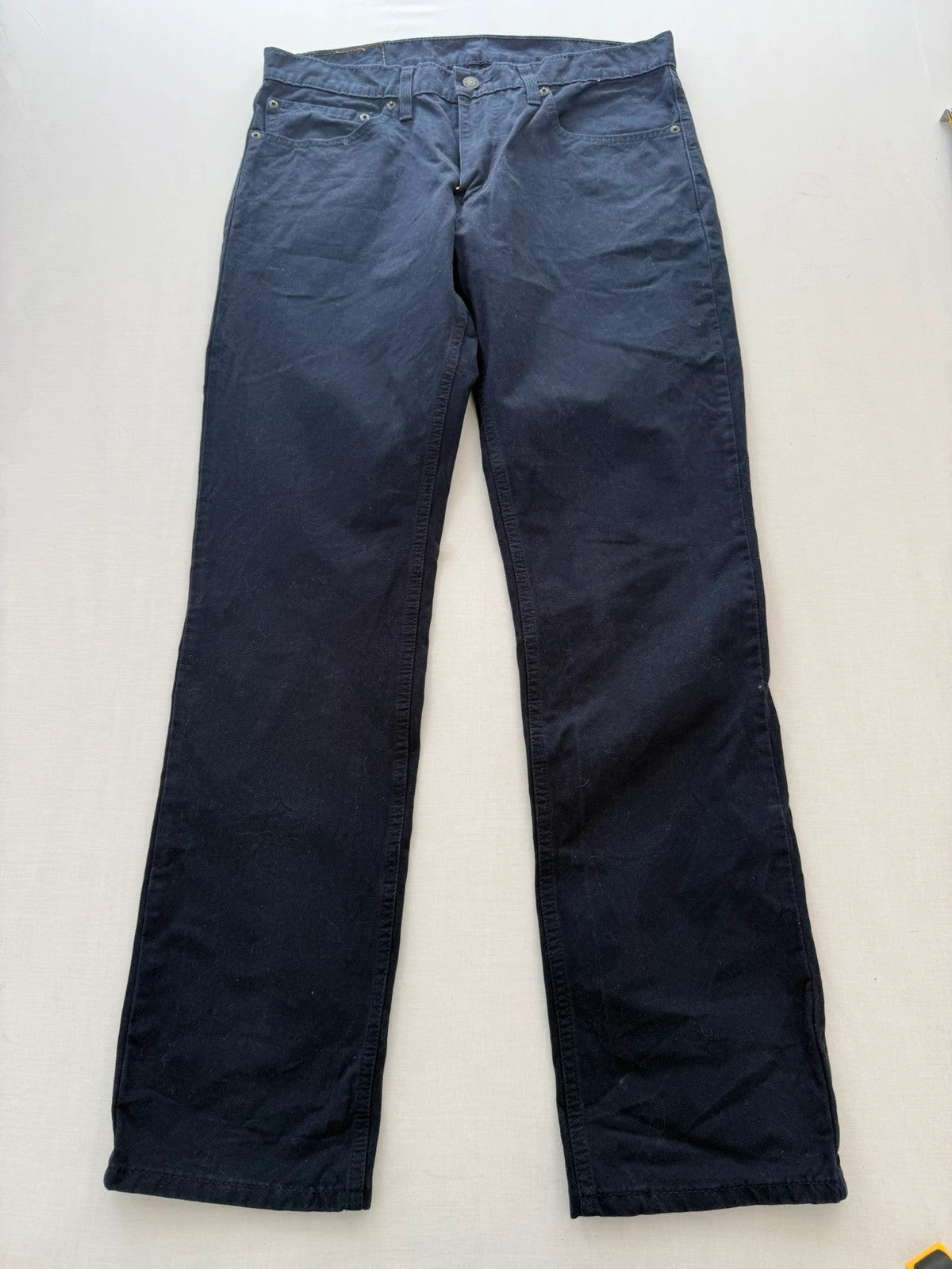 Levi's navy straight jeans with red tab logo and stretch cotton denim.