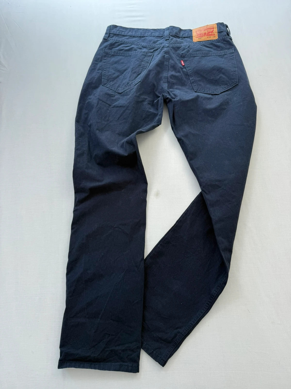 Levi's navy straight jeans with red tab logo and stretch cotton denim.