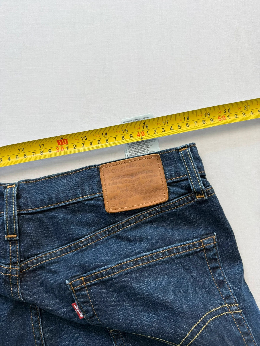 Levi's straight jeans navy blue stretch denim with premium label and altered length.