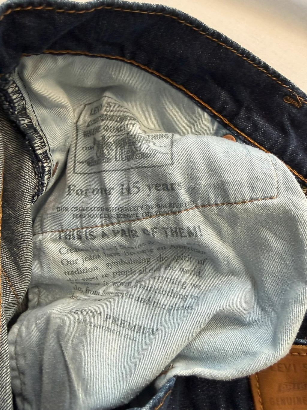 Levi's straight jeans navy blue stretch denim with premium label and altered length.