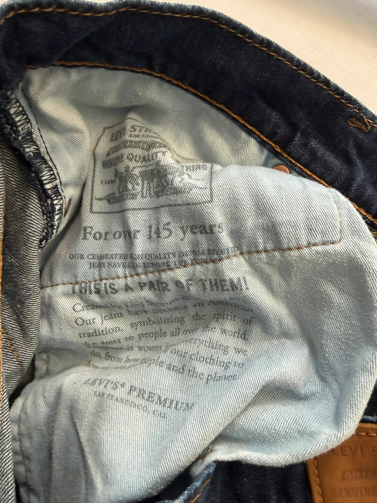 Levi's straight jeans navy blue stretch denim with premium label and altered length.