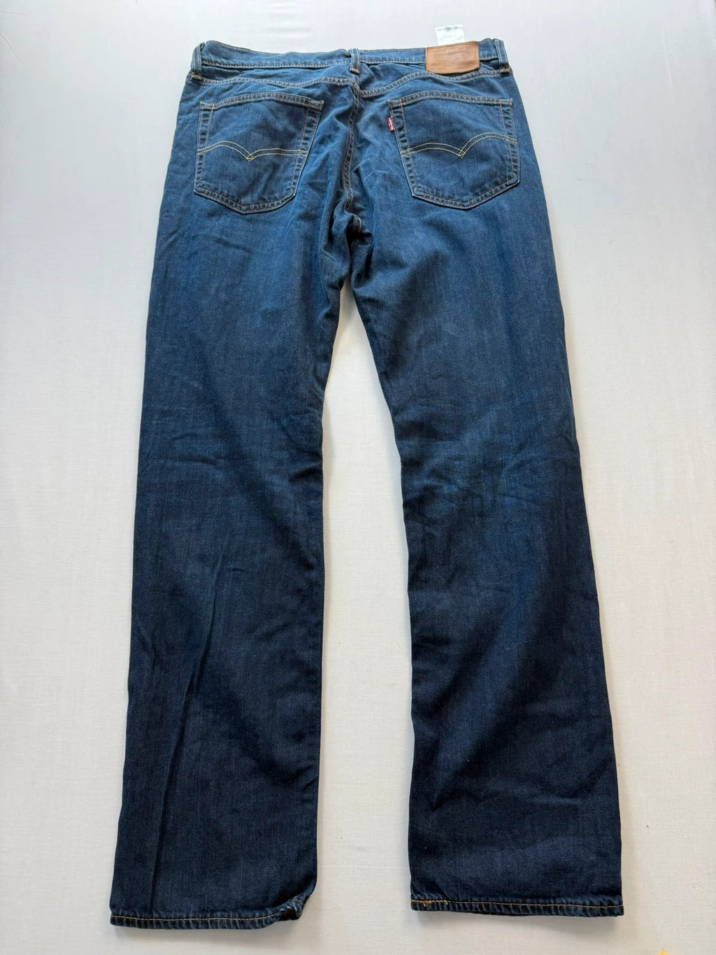 Levi's straight jeans navy blue stretch denim with premium label and altered length.