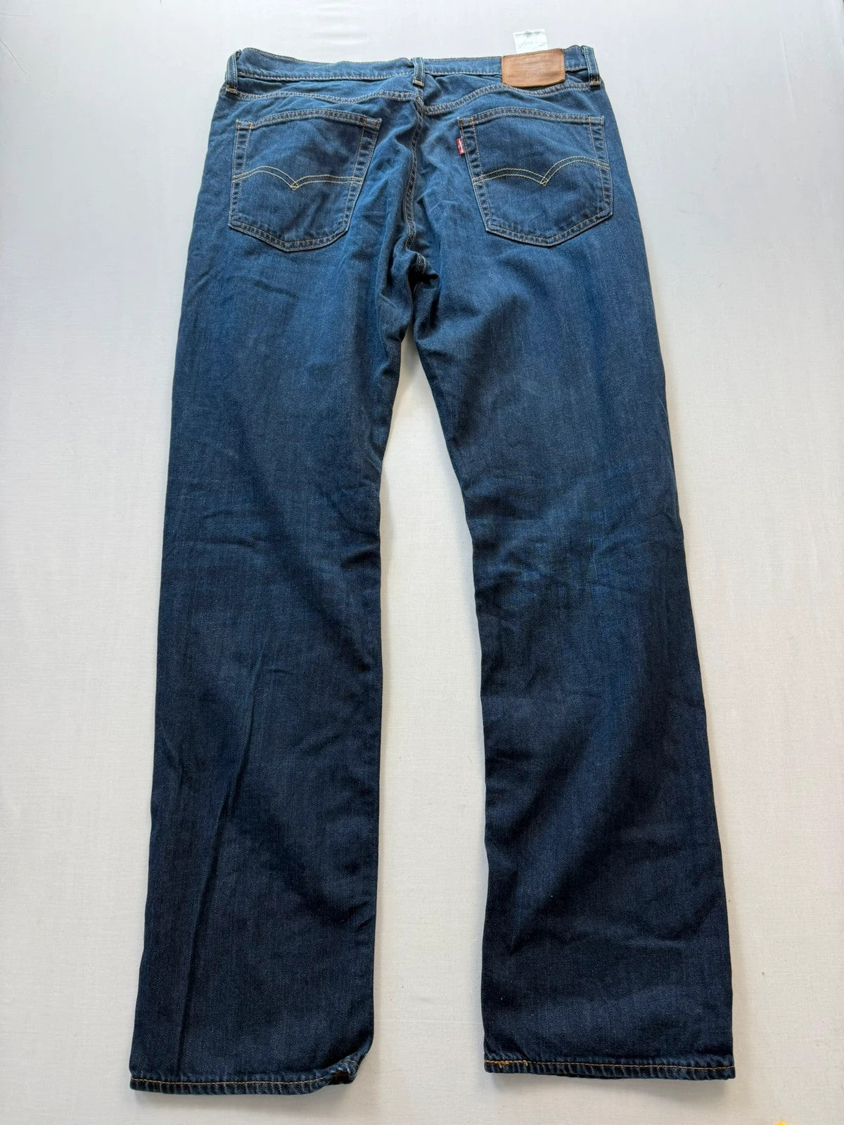 Levi's straight jeans navy blue stretch denim with premium label and altered length.