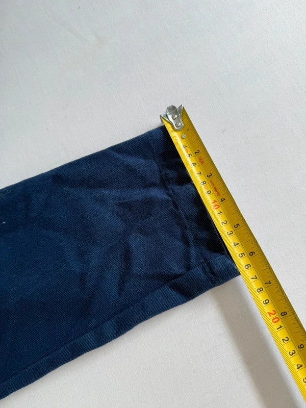 Lucy & Yak navy dungarees with adjustable straps, front bib pocket, and relaxed fit.