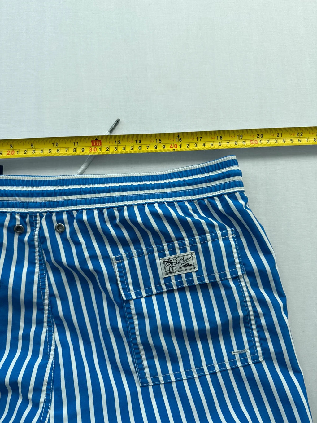 Ralph Lauren blue and white striped swim shorts with classic pony embroidery and drawstring waist.