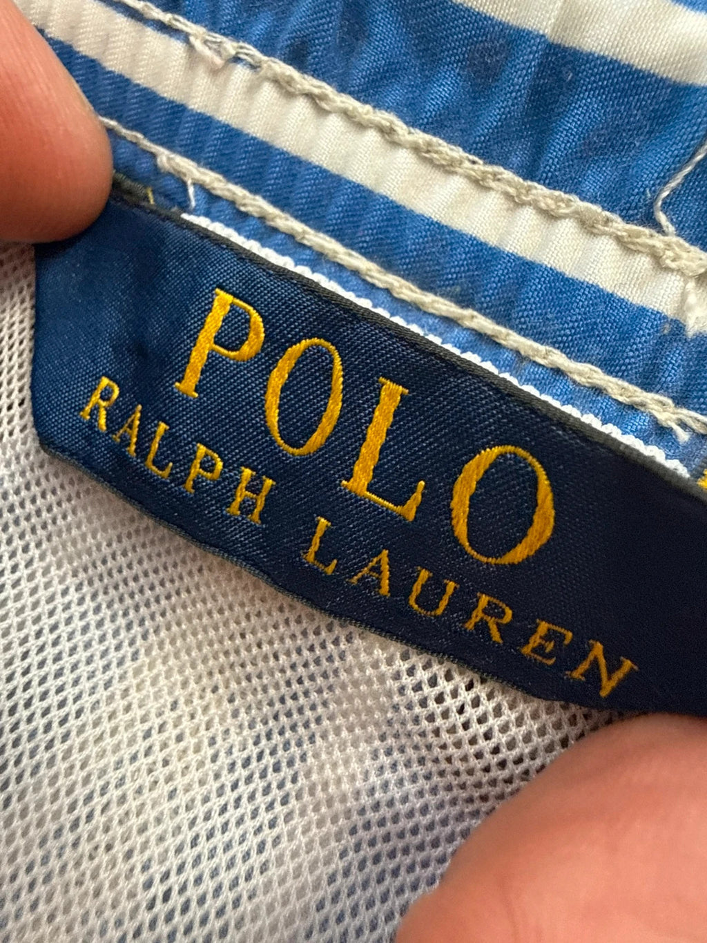 Ralph Lauren blue and white striped swim shorts with classic pony embroidery and drawstring waist.