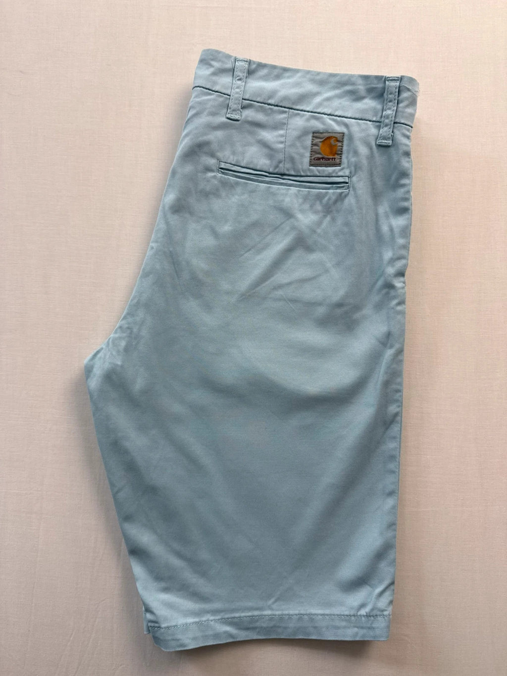 Carhartt light blue chino shorts with back pocket branded patch and soft stretch cotton twill.