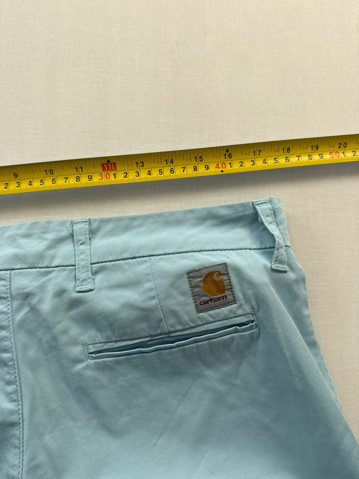 Carhartt light blue chino shorts with back pocket branded patch and soft stretch cotton twill.