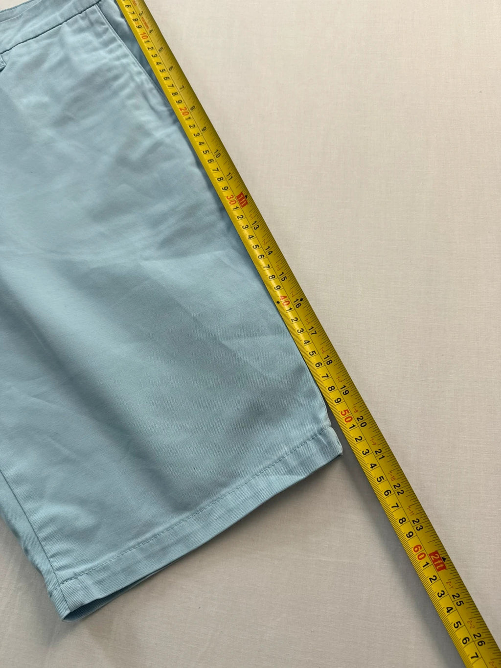 Carhartt light blue chino shorts with back pocket branded patch and soft stretch cotton twill.