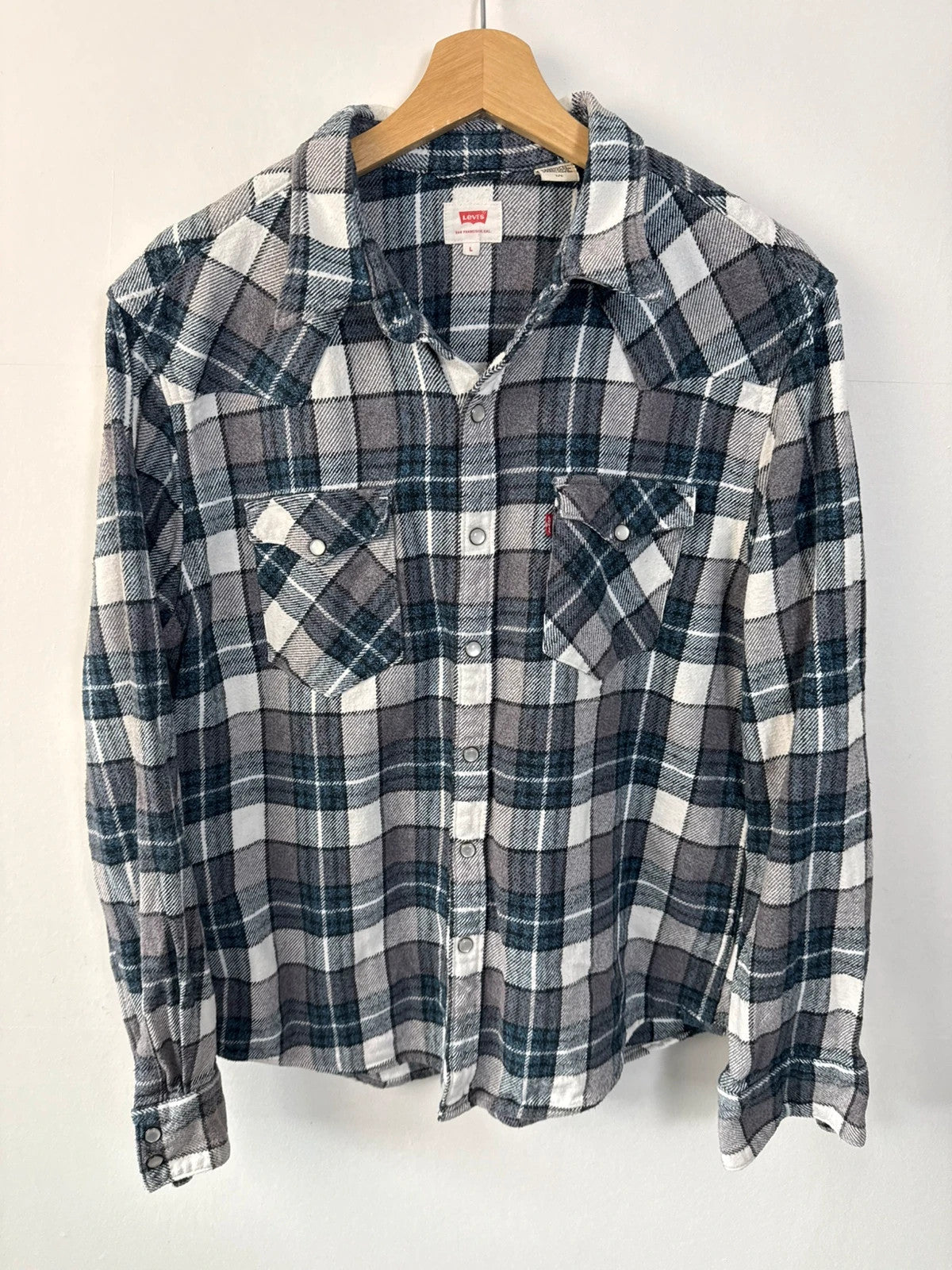 Levi's blue and grey plaid flannel shirt, thick cotton, chest button-flap pockets.