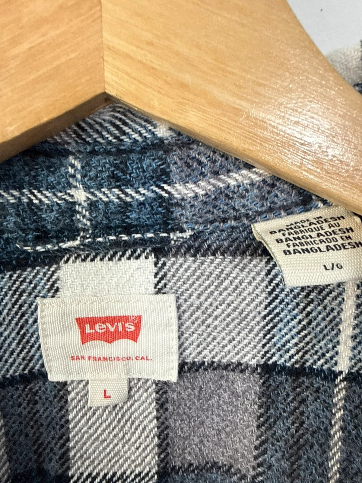 Levi's blue and grey plaid flannel shirt, thick cotton, chest button-flap pockets.