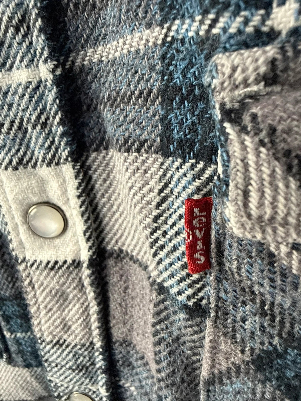 Levi's blue and grey plaid flannel shirt, thick cotton, chest button-flap pockets.