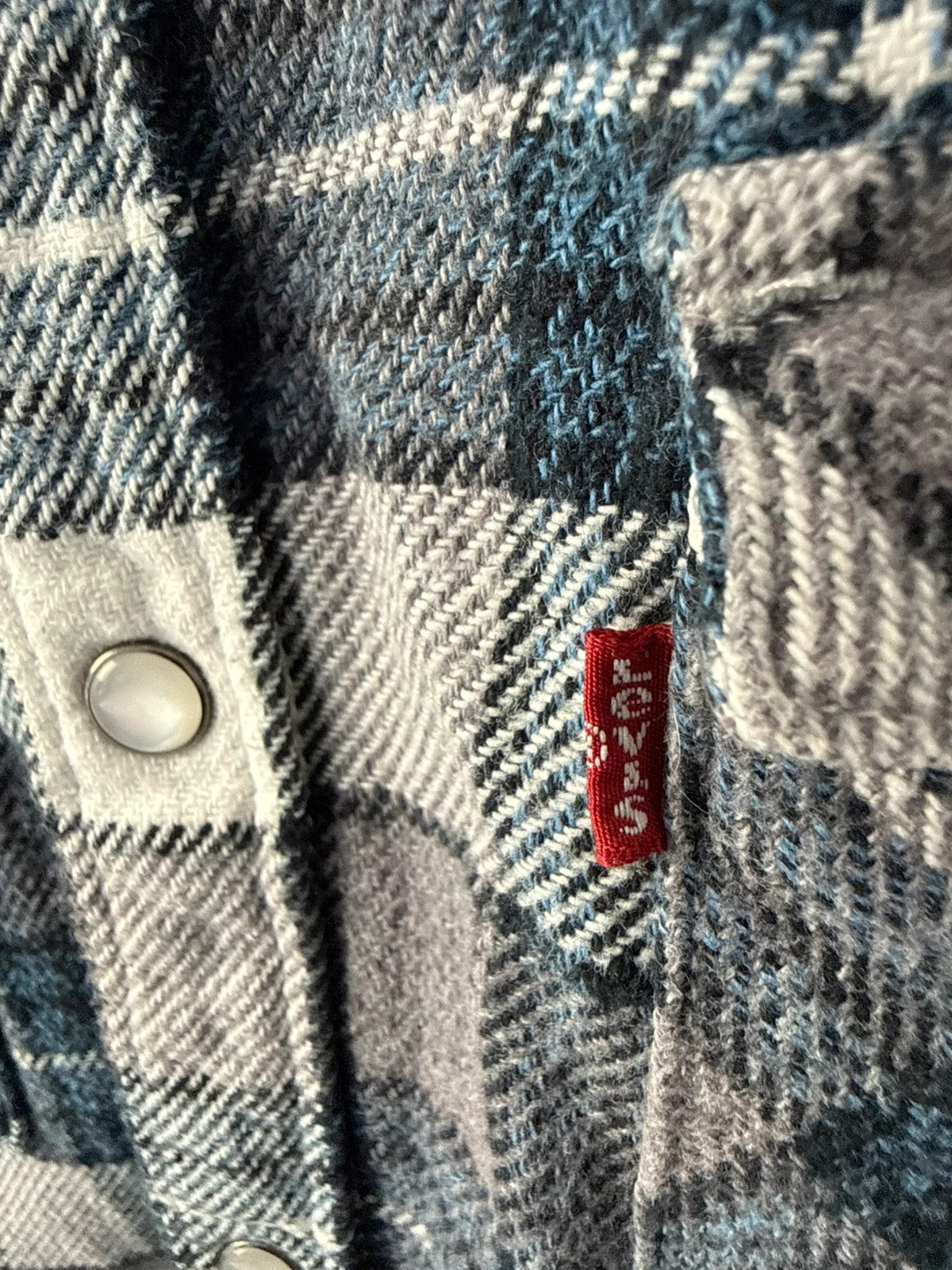 Levi's blue and grey plaid flannel shirt, thick cotton, chest button-flap pockets.