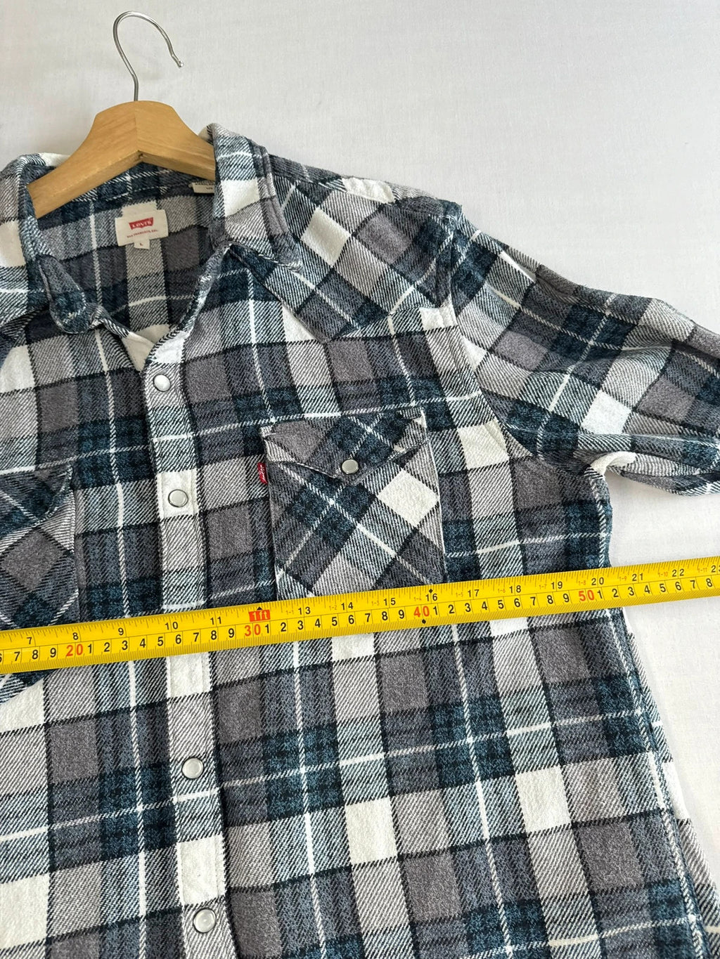 Levi's blue and grey plaid flannel shirt, thick cotton, chest button-flap pockets.