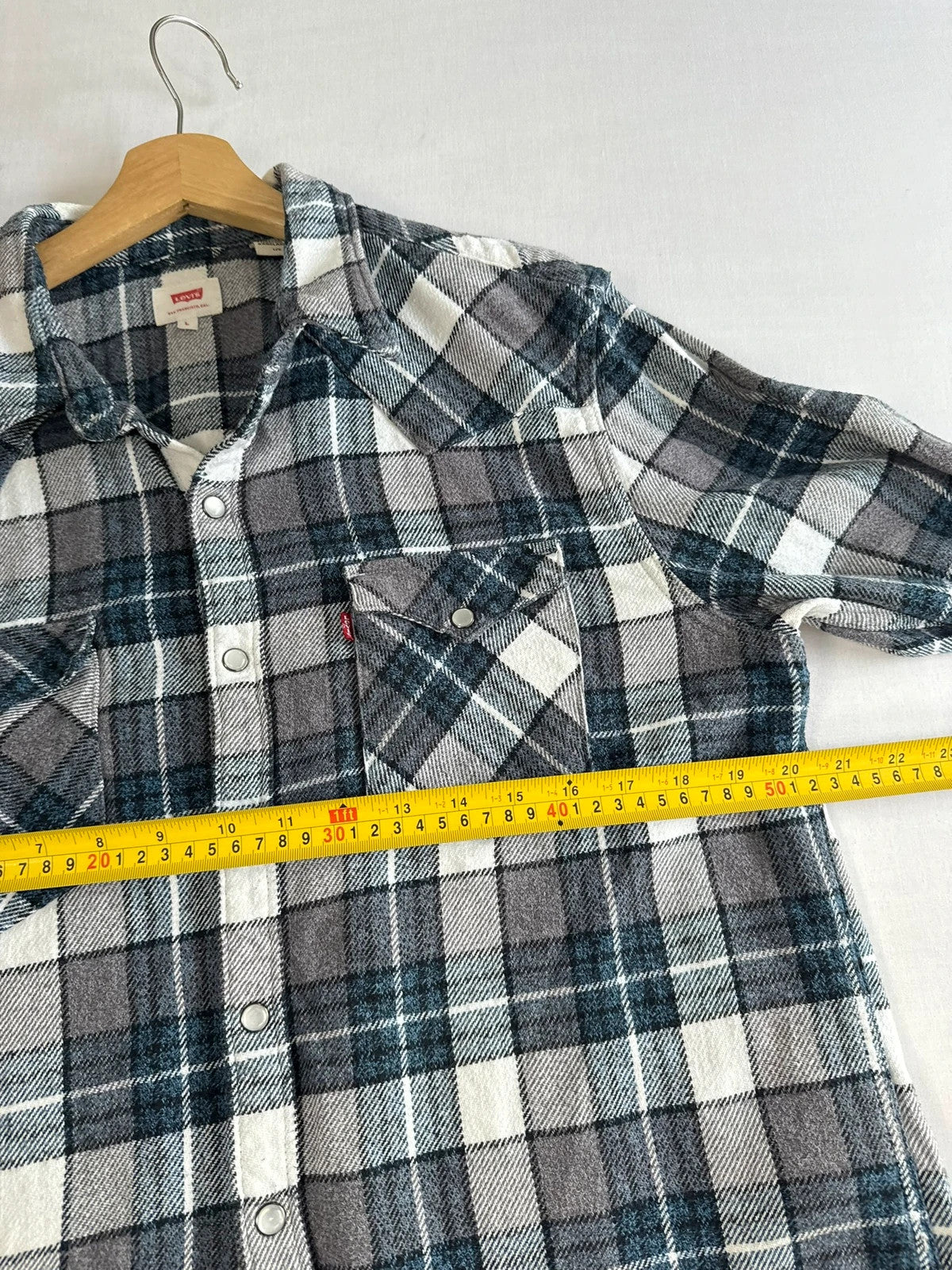 Levi's blue and grey plaid flannel shirt, thick cotton, chest button-flap pockets.