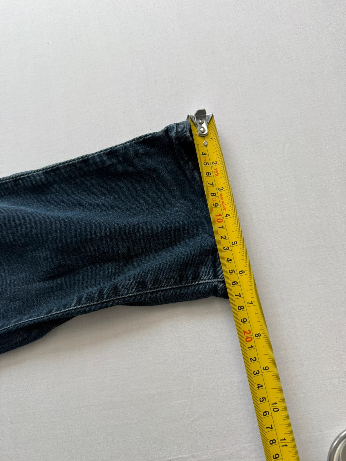 Levi's straight jeans dark indigo black wash with signature back arcuate stitching.