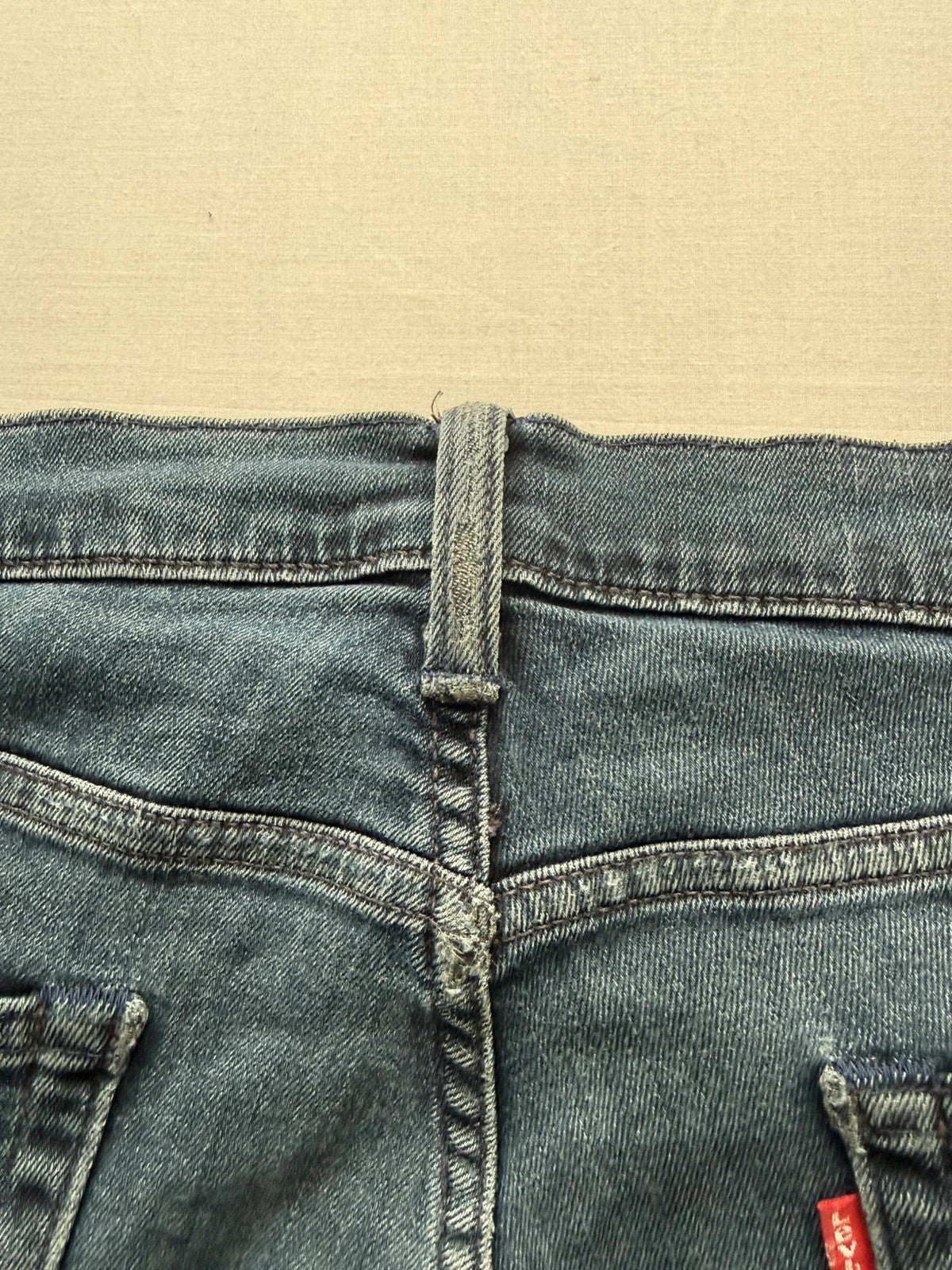 Levi's straight jeans dark indigo black wash with signature back arcuate stitching.