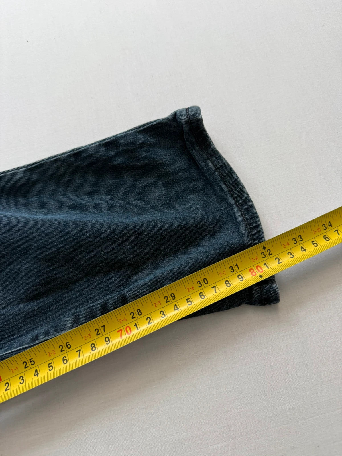 Levi's straight jeans dark indigo black wash with signature back arcuate stitching.