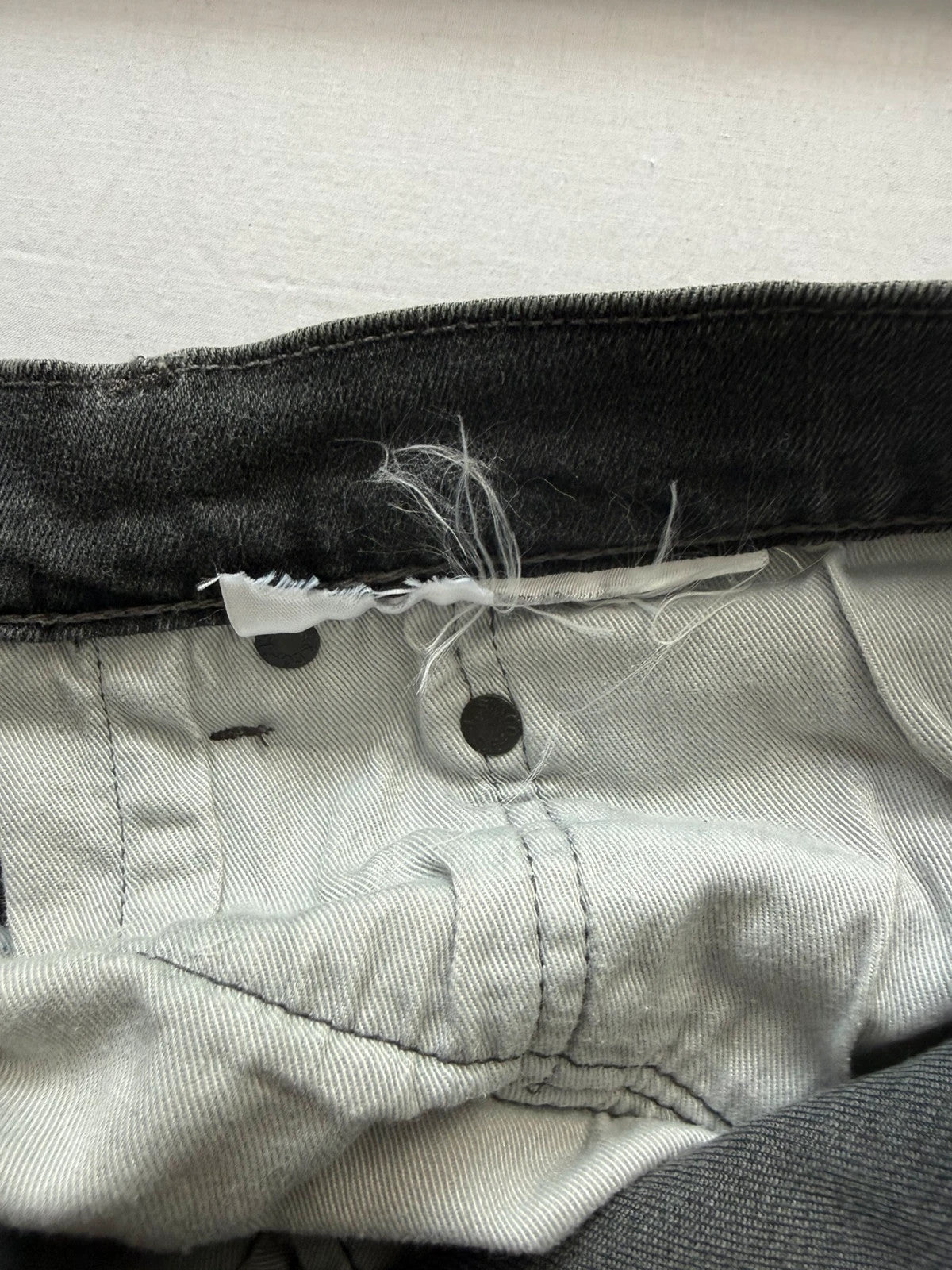 Levi's grey black slim fit jeans with classic five-pocket styling and back arcuate stitching.