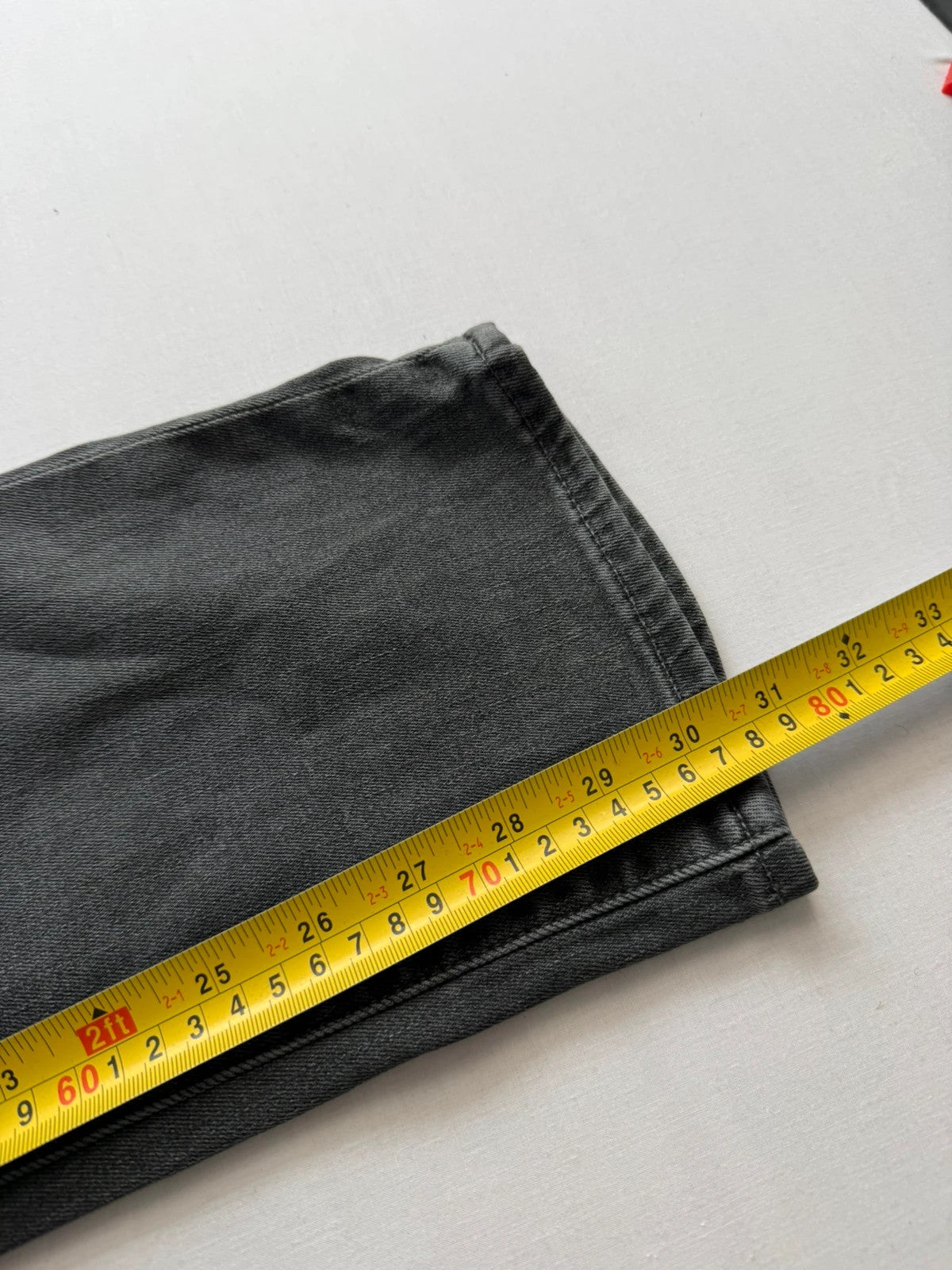 Levi's grey black slim fit jeans with classic five-pocket styling and back arcuate stitching.
